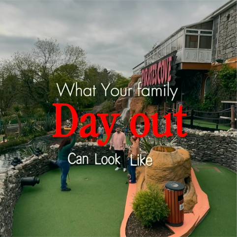 Family enjoying mini golf adventure day out.