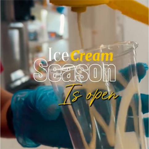 Pouring soft serve into cup, text Ice Cream Season Is Open displayed.